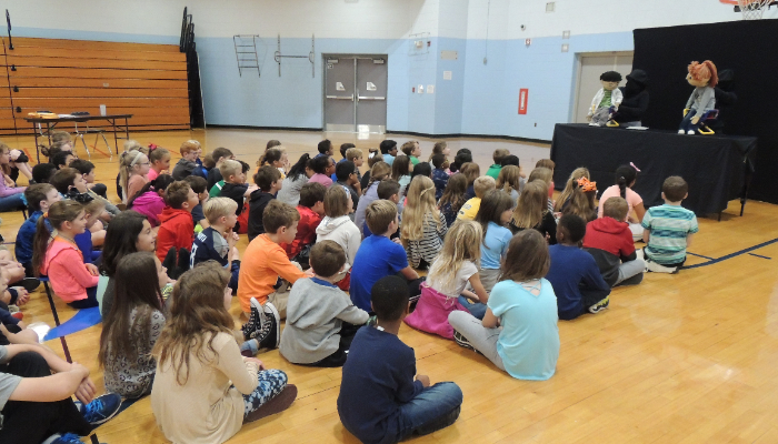 Third grade students listening to the new kids on the block show